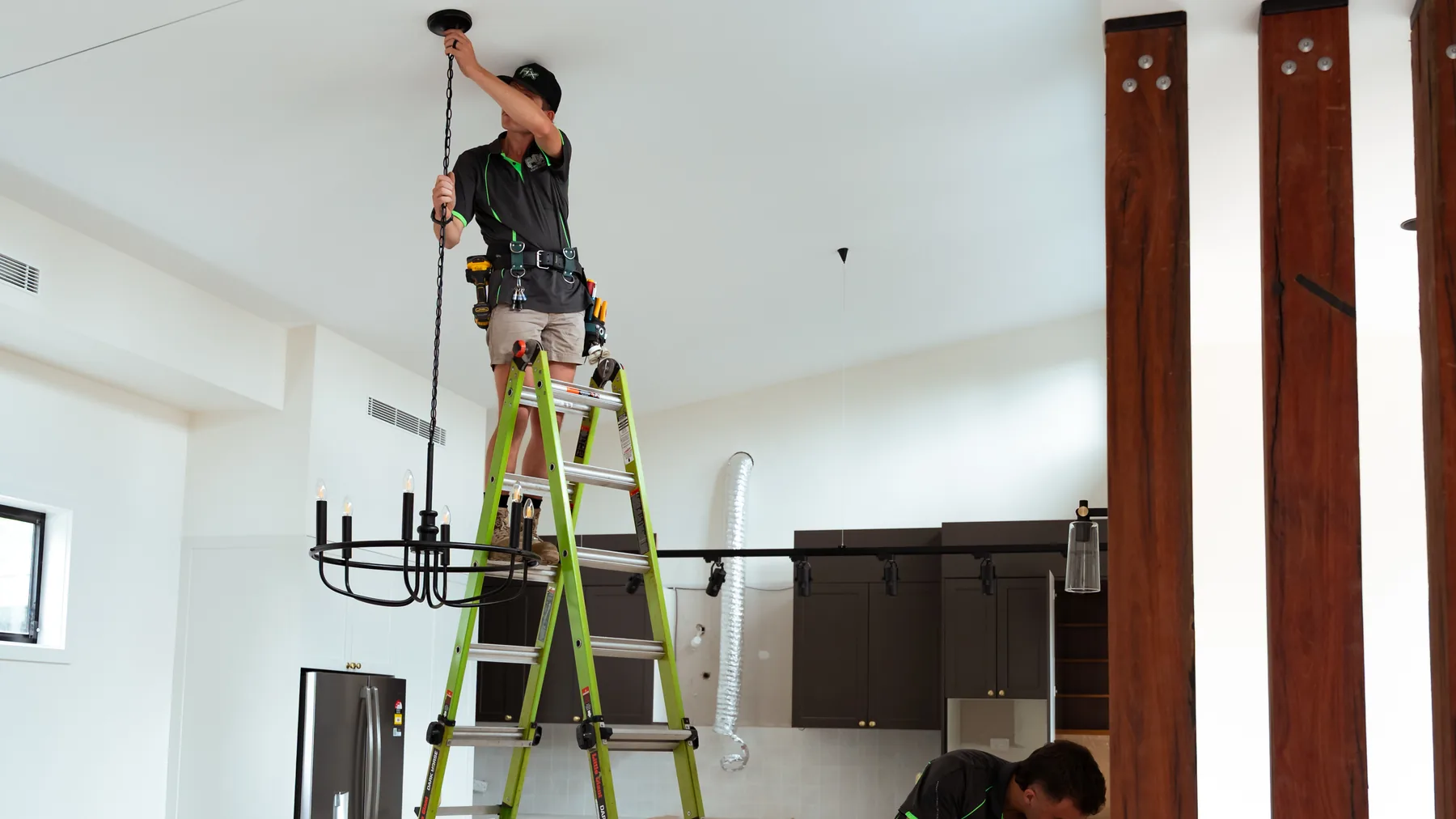 Electricians working in a new build during fitout