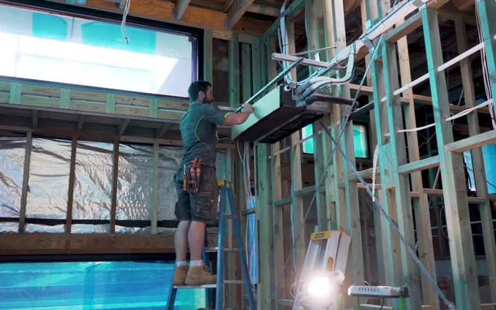 Electrician running services during a commercial fitout
