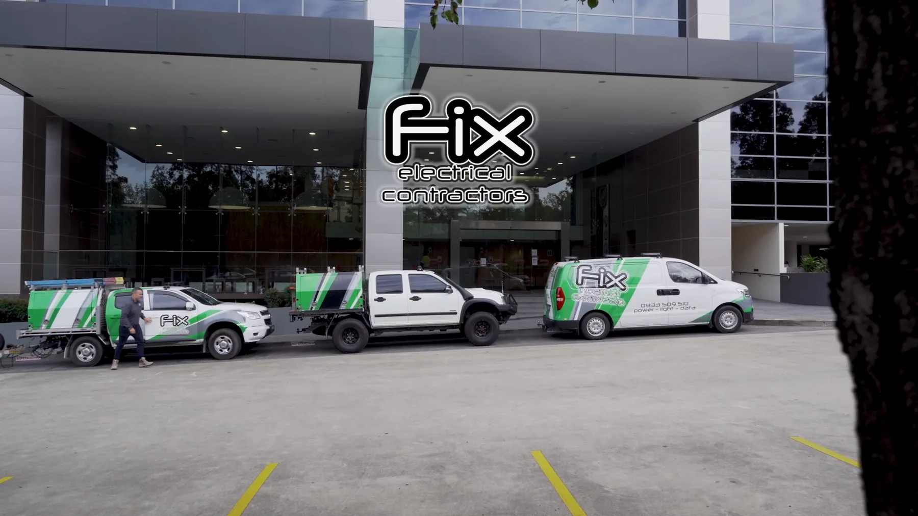 The Fix Electrical fleet outside a commercial building
