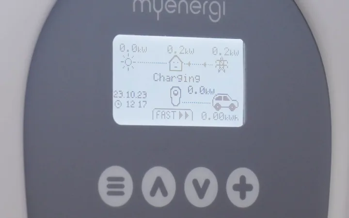The charger display showing solar, grid and vehicle power flow