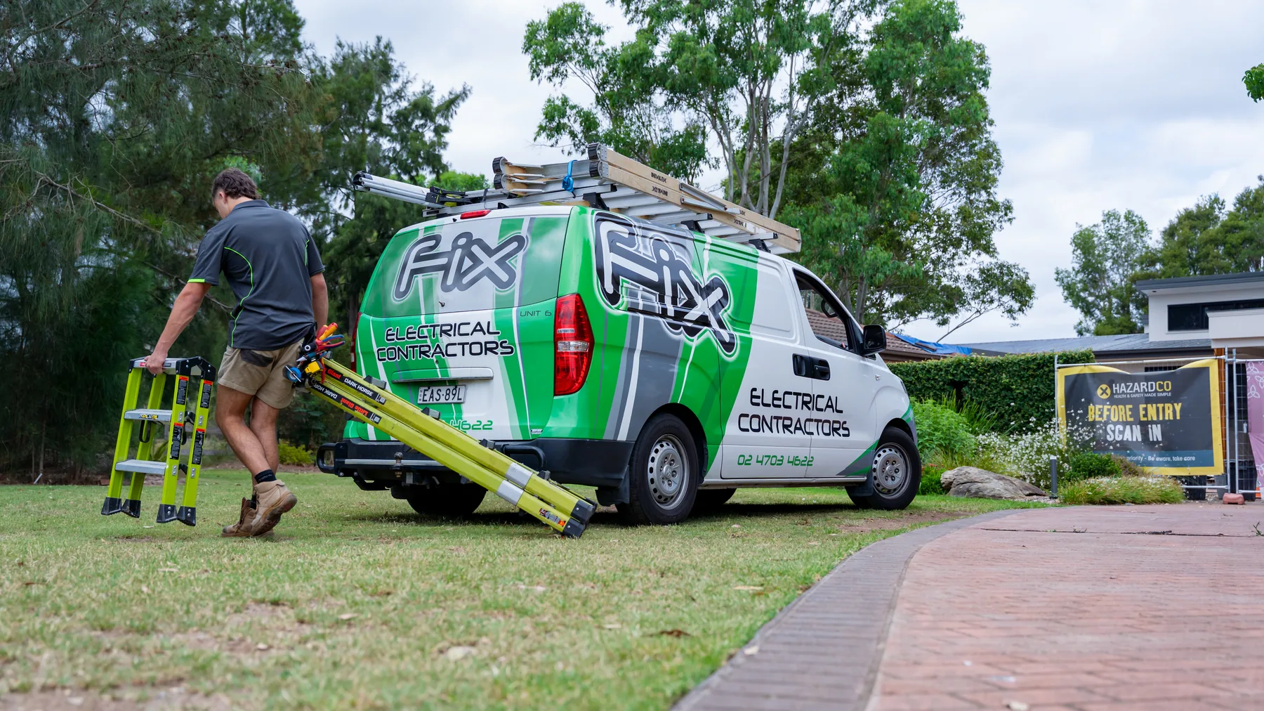 Fix Electrical electrician unloading a ladder from the van