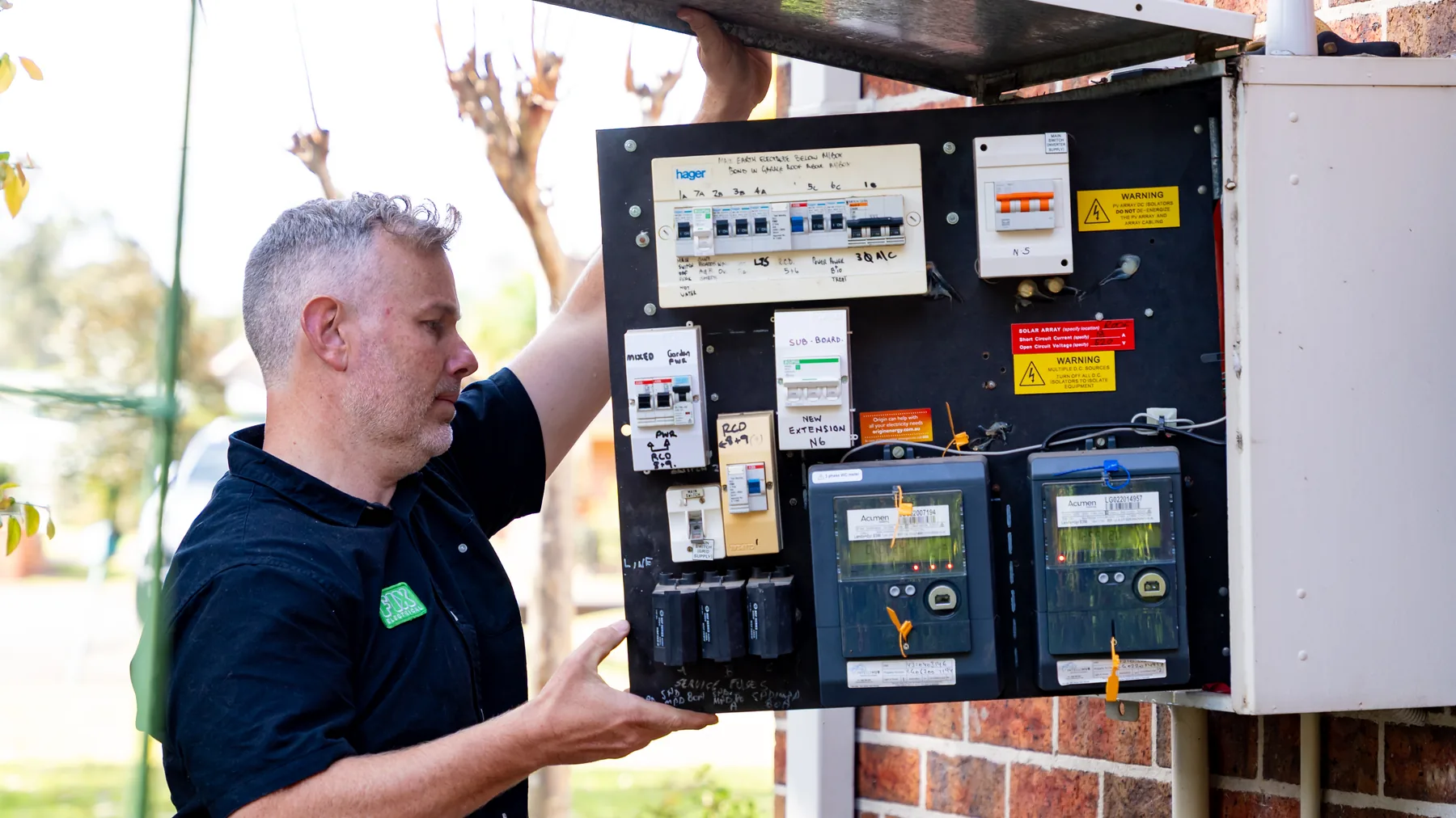 Electrician working at an outdoor meter box