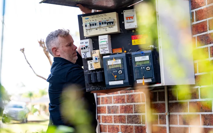 Electrician checking meter connections