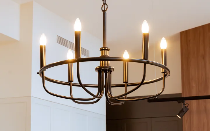 Finished chandelier above the kitchen island