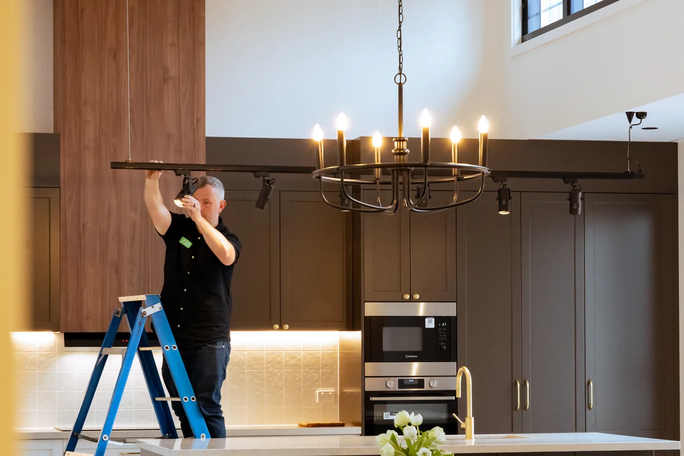 Kitchen and dining area with layered pendant lighting