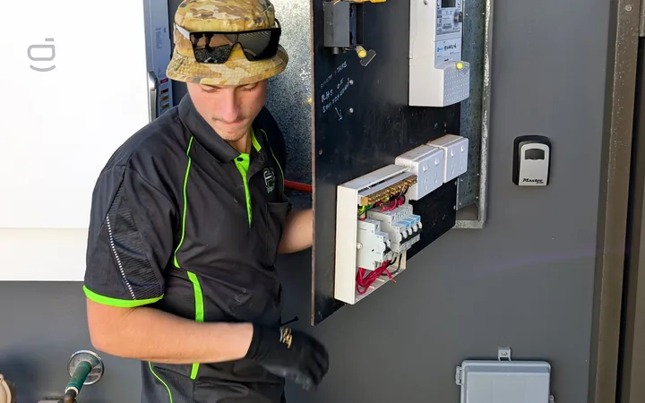 Fix Electrical electrician fitting new circuit breakers to an upgraded switchboard