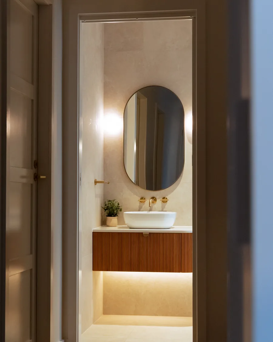 Hallway and vanity lighting in a completed home