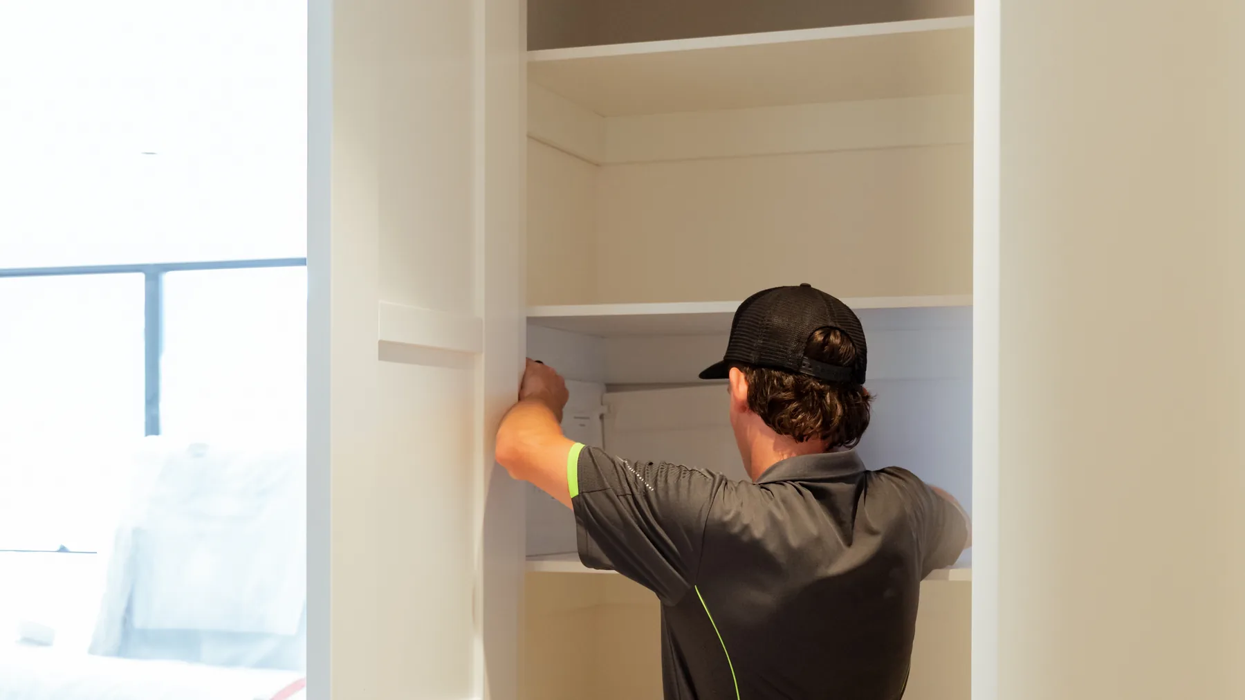 Electrician working at a switchboard cupboard