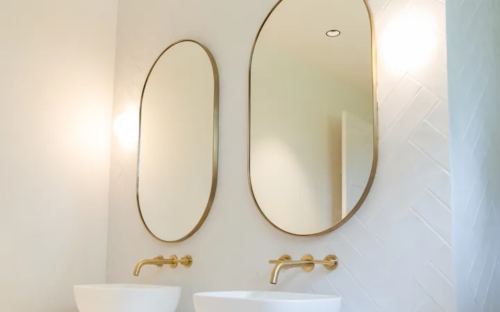 Finished bathroom with vanity lighting