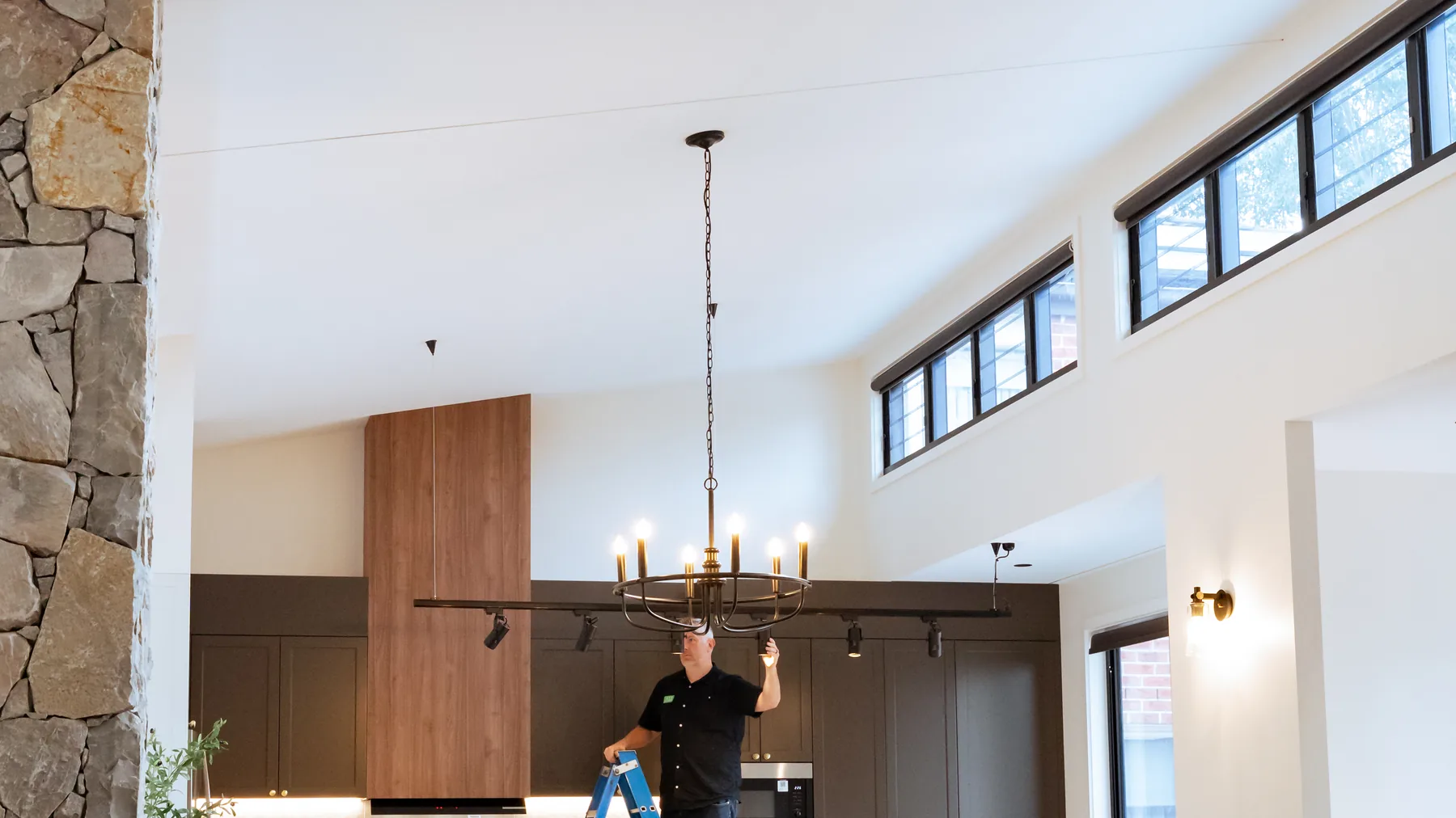 Open-plan living area with ceiling fan